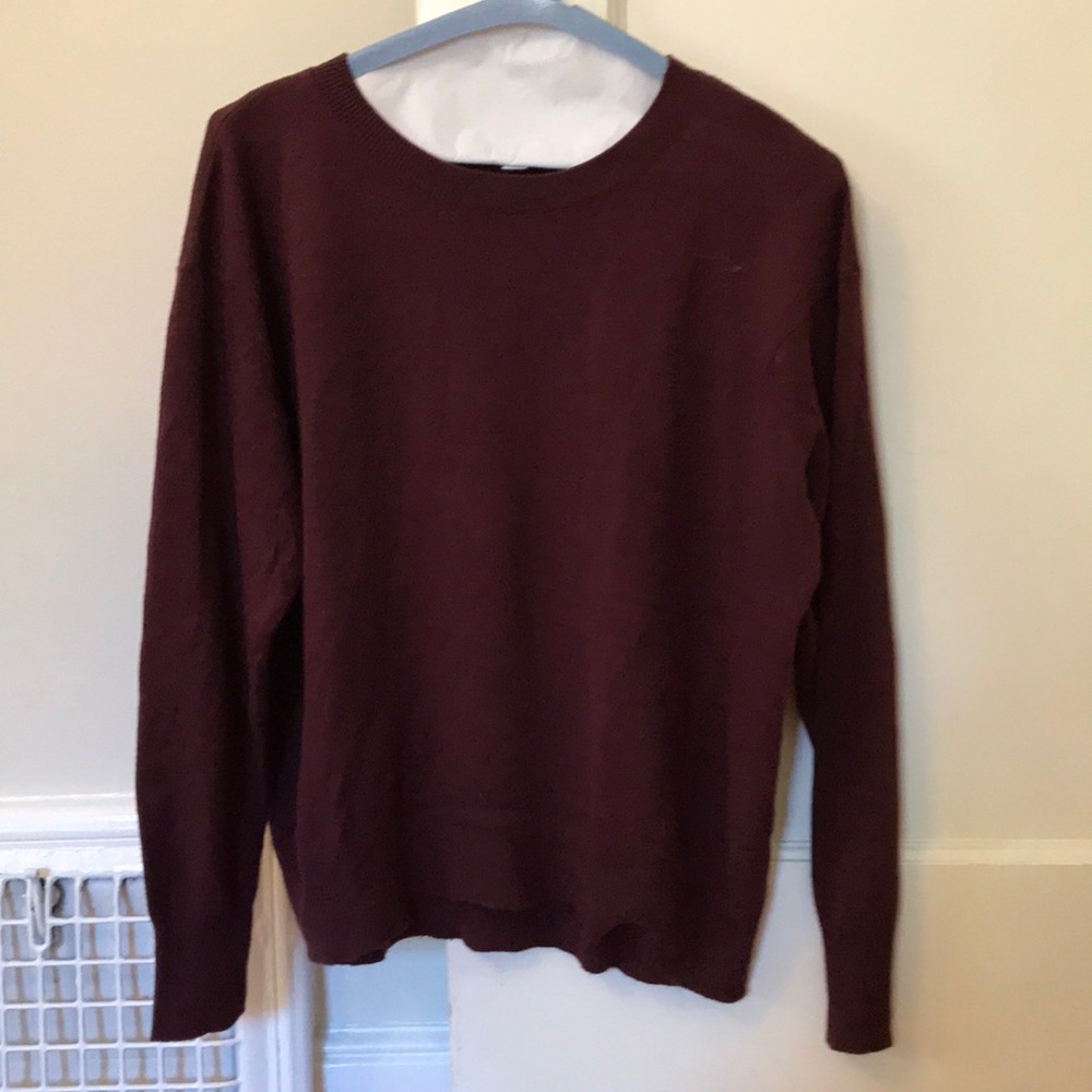 A maroon sweater.